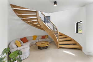 Living area featuring stairs