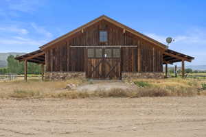 View of barn featuring a mountain view