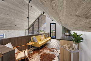 Bonus room with vaulted ceiling, hardwood / wood-style floors, and a mountain view