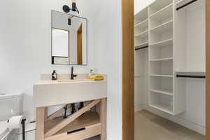 Bathroom featuring toilet and vanity