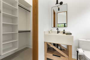 Bathroom with toilet and vanity