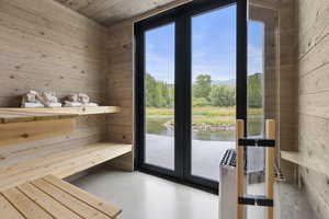 Relaxing sauna with wooden walls and concrete flooring