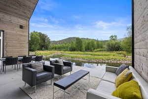 View of patio / terrace featuring an outdoor hangout area and a mountain view