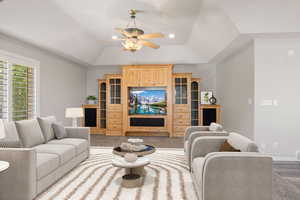 Living area with ceiling fan, vaulted ceiling, and recessed lighting