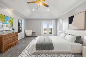 Carpeted bedroom featuring crown molding, recessed lighting, a ceiling fan, and a tray ceiling