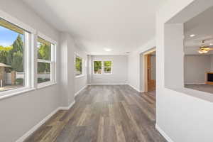 Empty room with wood finished floors, recessed lighting, and ceiling fan