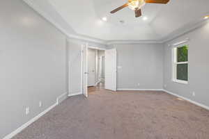 Unfurnished bedroom with crown molding, carpet flooring, a ceiling fan, and recessed lighting