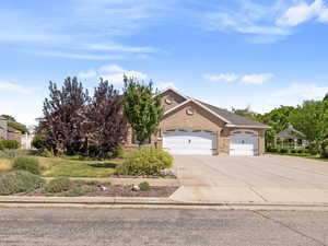 View of front of home featuring a garage and driveway