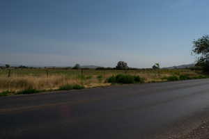 View of asphalt road with a rural view and a mountain view