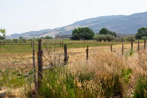 View of mountain background featuring rural landscape