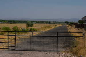 View of yard featuring a view of countryside and a mountain view