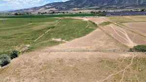 View of mountain background featuring rural landscape