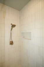 Full bathroom with tiled shower