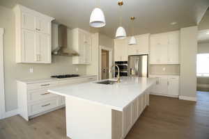 Wonderful. Designed kitchen space, Includes 36 inch cooktop, Double Ovens/Microwave and also includes the refrigerator.  You will love the walk in pantry with and the large Island.  Cabinets are custom made with soft close hinges, and adjustable shelves,