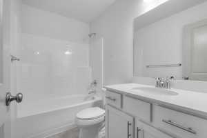 Bathroom featuring vanity and shower / bath combination