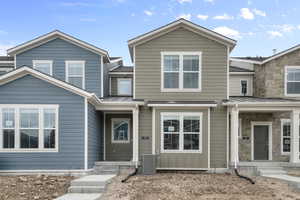 View of front of home with a standing seam roof and a metal roof
