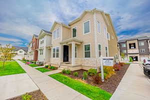 View of front of property with a residential view and stone siding