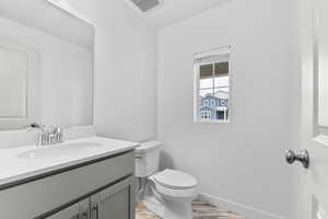 Bathroom featuring toilet and vanity