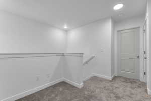 Walk in closet with carpet flooring