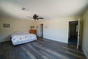 Bedroom featuring wood finished floors and a ceiling fan