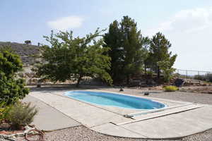 Outdoor pool with a patio area