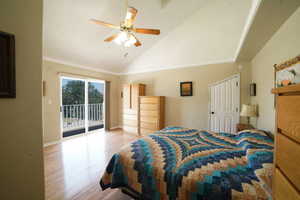 Bedroom with access to exterior, light wood-style flooring, high vaulted ceiling, and ceiling fan