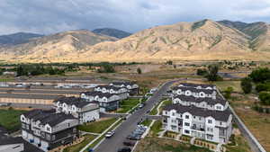 View of mountain backdrop featuring nearby suburban area