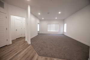 Empty room featuring recessed lighting and wood finished floors