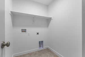 Washroom with washer hookup and electric dryer hookup