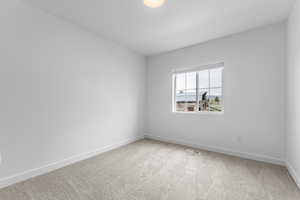 Empty room featuring carpet flooring