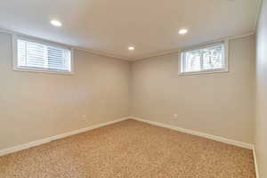 Below grade area with carpet floors and recessed lighting