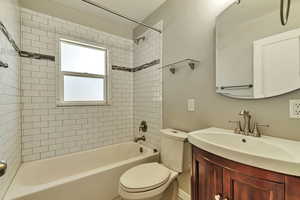 Full bath featuring vanity and  shower combination