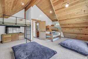 Carpeted bedroom featuring wood ceiling, high vaulted ceiling, and recessed lighting