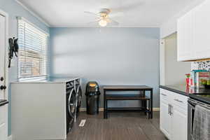 Washroom with washer and clothes dryer and ceiling fan