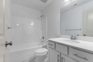 Bathroom with vanity and tub / shower combination