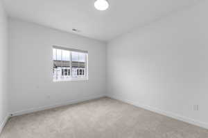 Spare room with light carpet
