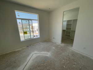 Unfurnished bedroom featuring a spacious closet
