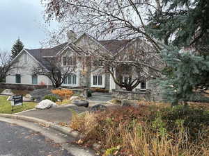 Obstructed view of property featuring a chimney
