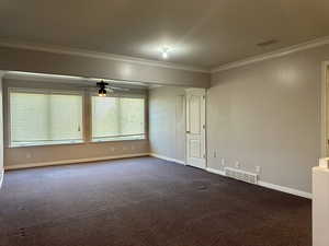 Primary bedroom's spacious flex room with large windows and extra storage