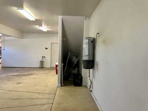 Garage with a central vacuum unit and radiator heating unit