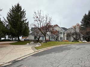 Traditional-style house with a front yard