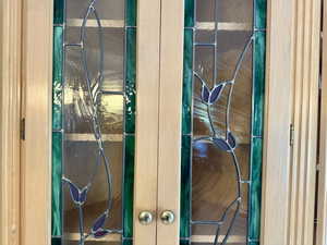 Detailed view of custom etched glass cabinet