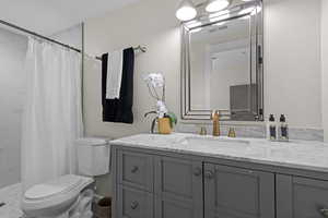 Bathroom with vanity and a tile shower