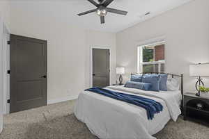 Bedroom with carpet floors and a ceiling fan