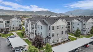 Aerial perspective of suburban area featuring a mountainous background