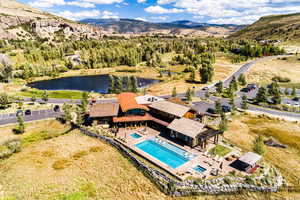 Bird's eye view of a pool area and a water and mountain view