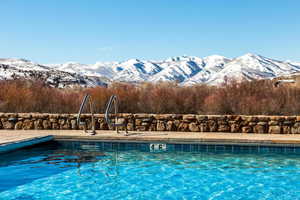 Community pool with a mountain view