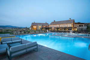 Community pool featuring an outdoor hangout area, a community hot tub, and a patio