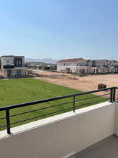 Balcony with a residential view and a mountain view