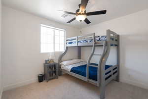 Bedroom with carpet and a ceiling fan